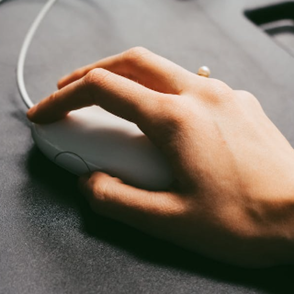 Person Holding Computer Mouse