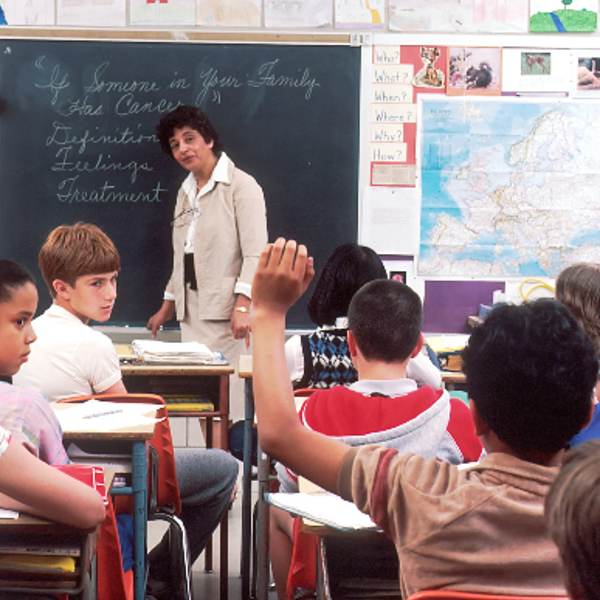 woman standing in front of children