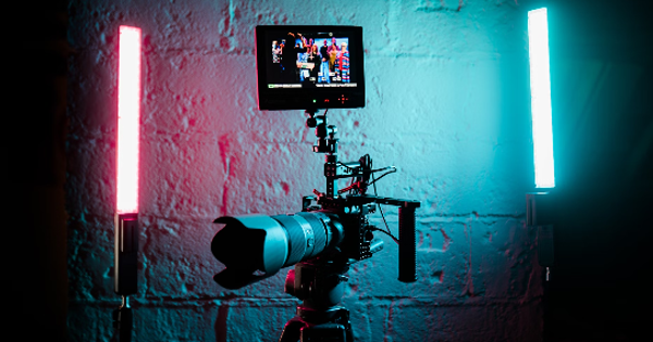 a camera set up in front of a brick wall