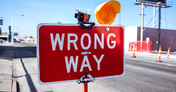 red Wrong Way signage on road