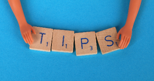 Scrabble Tiles on a Blue Surface Tips