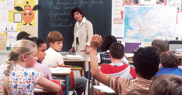 woman standing in front of children